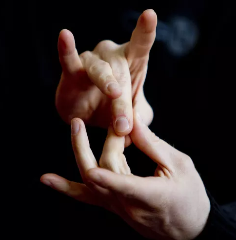 two hands signing the ASL sign for the word connect.