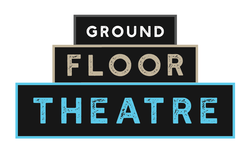 Logo for Ground floor theatre. Three large rectangles stacked onto of each other, each one is smaller than the other. The smallest on top has a grey frame, with white text inside "Ground". The middle has a tan frame with tan text inside "Floor". The bottom is the largest, with a blue frame, and blue text "Theatre".